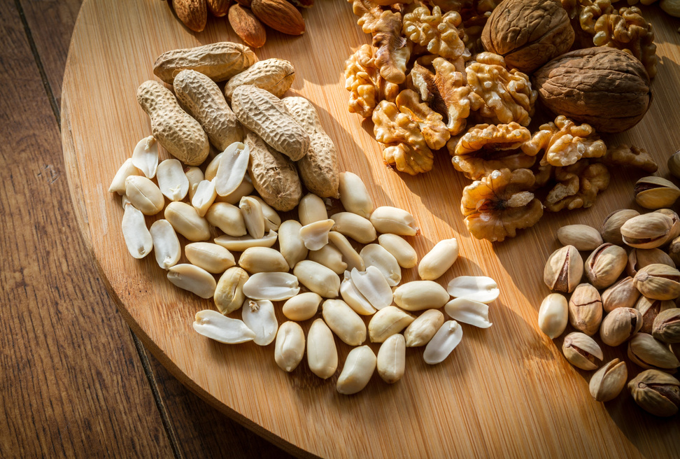 Mixed Nuts on Wooden Background